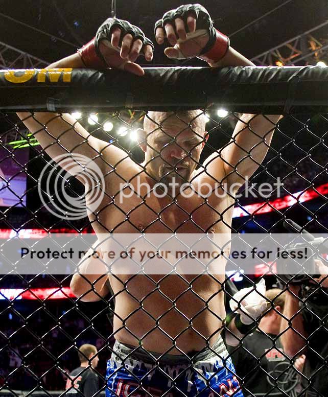 Chuck Liddell leans against cage (Zuffa)
